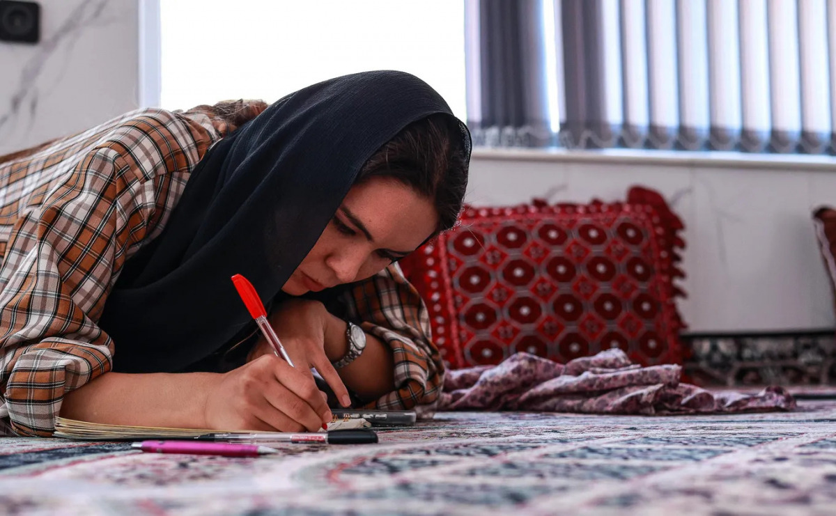 A young woman doing her English homework at home, while the Taliban have forbidden women from attending school after the age of twelve, Herat, Afghanistan, 17 September 2025
In Afghanistan, girls face immense challenges from an early age. Many are denied access to basic education, forced into child labor, and must navigate strict societal norms including mandatory veiling. This reportage explores the daily lives of Afghan girls, their struggles for education, the impact of cultural and political restrictions, and their resilience in the face of adversity. Locations range from Kabul to rural provinces, highlighting both urban and remote realities.//SEMENOVAMARIA_sipa.21225/Credit:Semenova Maria/SIPA/2511051344